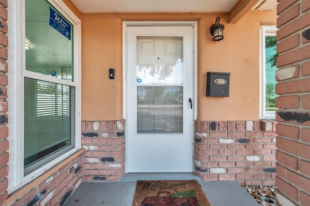 1117 Tyrone Blvd N, Saint Petersburg, FL 33710 - property entrance featuring brick siding and stucco siding