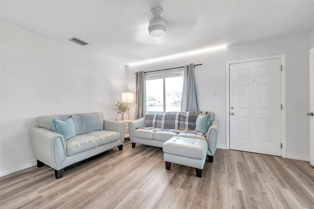 1117 Tyrone Blvd N, Saint Petersburg, FL 33710 - living room featuring light wood finished floors and baseboards