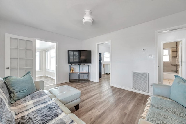 1117 Tyrone Blvd N, Saint Petersburg, FL 33710 - living area featuring light wood-style floors and baseboards