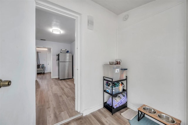1117 Tyrone Blvd N, Saint Petersburg, FL 33710 - hallway featuring wood finished floors and baseboards