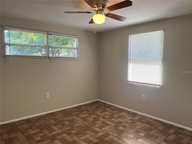 10367 109th Ave, Largo, FL 33773 - empty room featuring baseboards, brick patterned flooring, and ceiling fan