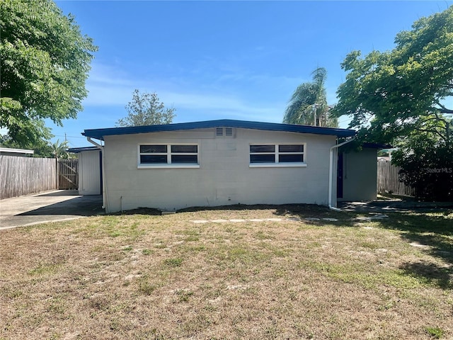 10367 109th Ave, Largo, FL 33773 - rear view of house with concrete block siding