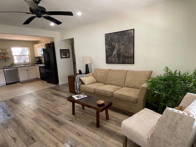 2748 Crk 543, Sumterville, FL 33585 - living room featuring light wood-style flooring, a ceiling fan, and recessed lighting
