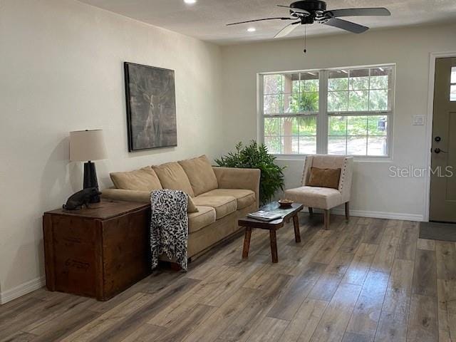 2748 Crk 543, Sumterville, FL 33585 - living room featuring a ceiling fan, wood finished floors, baseboards, and recessed lighting