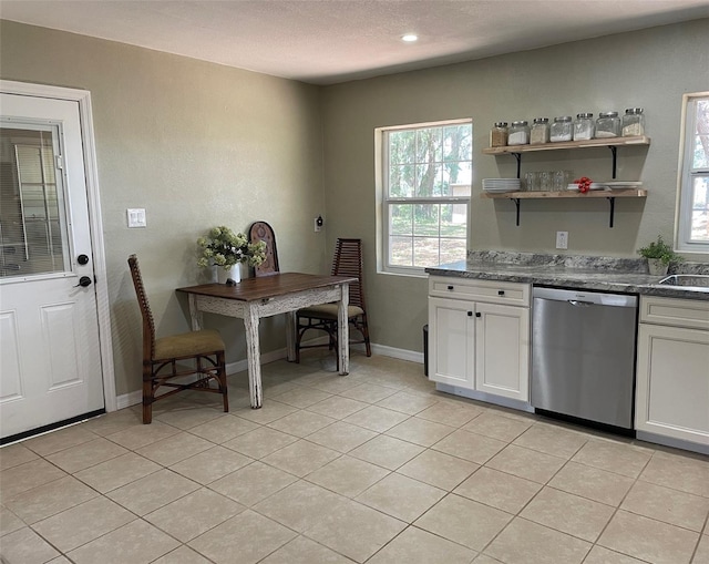2748 Crk 543, Sumterville, FL 33585 - kitchen with stainless steel dishwasher, healthy amount of natural light, white cabinets, light tile patterned floors, and recessed lighting