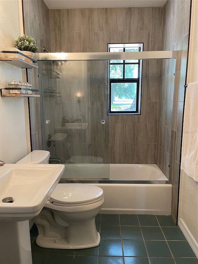 2748 Crk 543, Sumterville, FL 33585 - full bathroom featuring tile patterned floors, toilet, and bath / shower combo with glass door