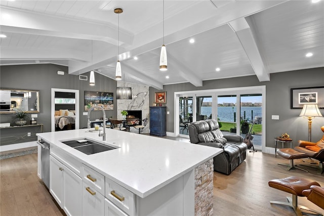 4649 Neptune Dr SE, Saint Petersburg, FL 33705 - kitchen with a sink, open floor plan, and light wood-style floors