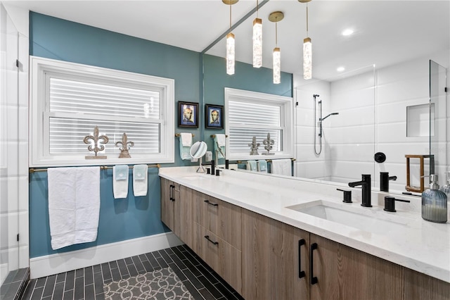 4649 Neptune Dr SE, Saint Petersburg, FL 33705 - bathroom featuring double vanity, a shower, tile patterned floors, and baseboards
