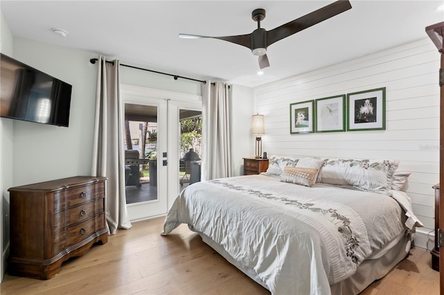 4649 Neptune Dr SE, Saint Petersburg, FL 33705 - bedroom with access to outside, wood finished floors, wooden walls, ceiling fan, and recessed lighting
