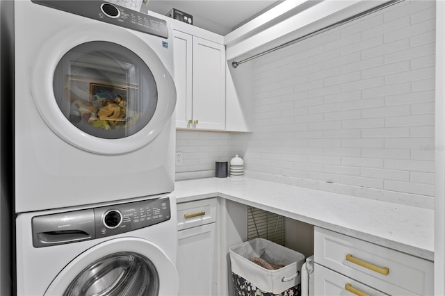4649 Neptune Dr SE, Saint Petersburg, FL 33705 - laundry room with cabinet space and stacked washer and clothes dryer
