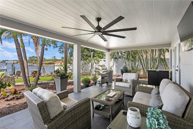 4649 Neptune Dr SE, Saint Petersburg, FL 33705 - sunroom featuring an outdoor living space, a ceiling fan, a water view, and wooden ceiling