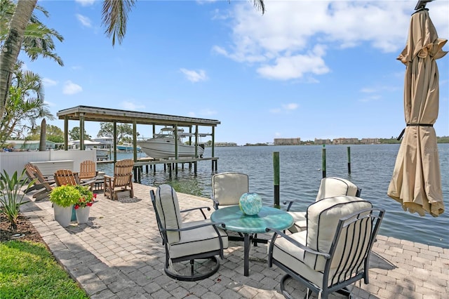 4649 Neptune Dr SE, Saint Petersburg, FL 33705 - view of patio with a boat dock, a water view, and boat lift