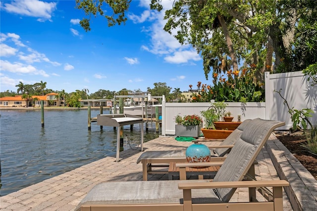 4649 Neptune Dr SE, Saint Petersburg, FL 33705 - dock area featuring boat lift and a water view