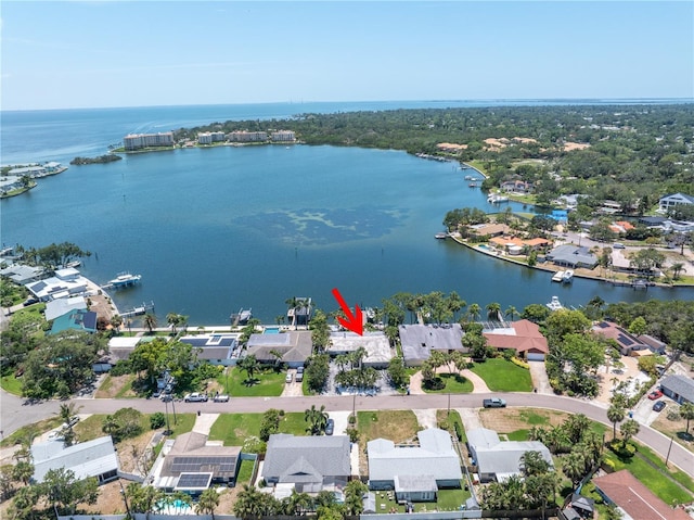 4649 Neptune Dr SE, Saint Petersburg, FL 33705 - aerial perspective of suburban area with a large body of water