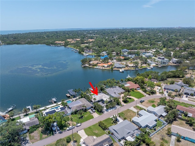 4649 Neptune Dr SE, Saint Petersburg, FL 33705 - aerial perspective of suburban area with a nearby body of water