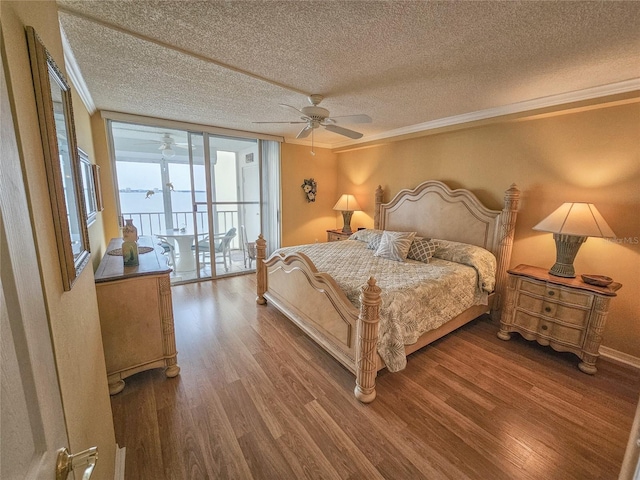 6060 Shore Dr S Unit 906, Gulfport, FL 33707 - bedroom with a textured ceiling, wood finished floors, crown molding, access to outside, and a ceiling fan