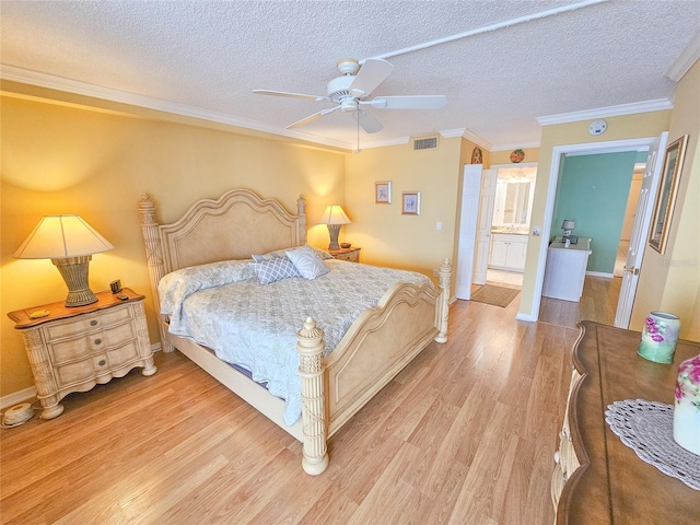 6060 Shore Dr S Unit 906, Gulfport, FL 33707 - bedroom with light wood-style flooring, ornamental molding, a textured ceiling, baseboards, and a ceiling fan