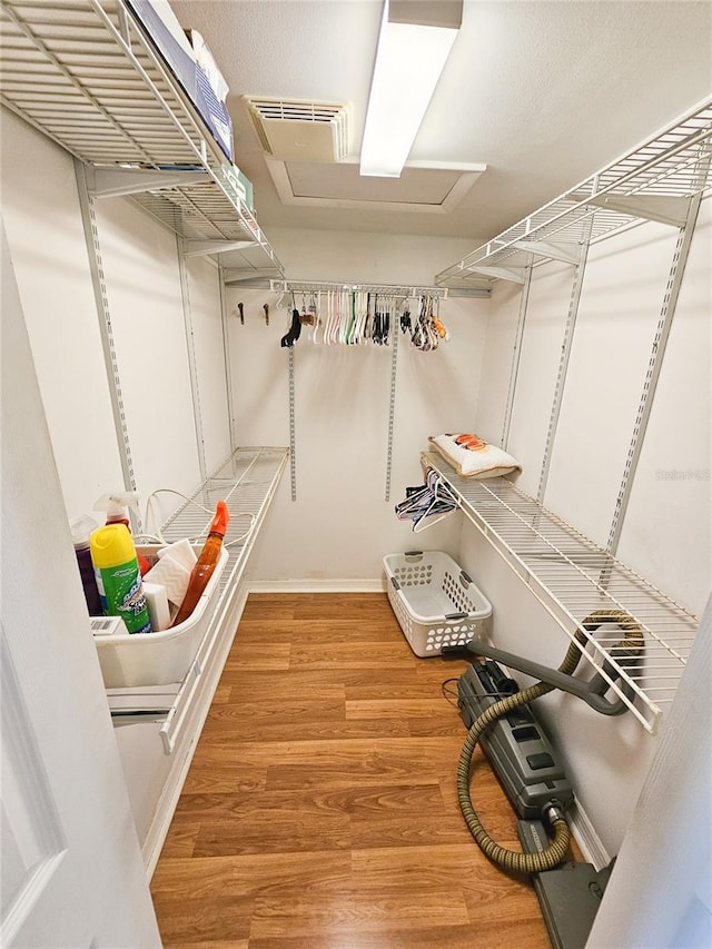 6060 Shore Dr S Unit 906, Gulfport, FL 33707 - spacious closet featuring wood finished floors