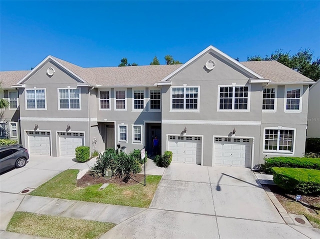 608 Black Lion Dr NE, Saint Petersburg, FL 33716 - view of property with driveway, a garage, and stucco siding