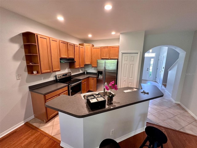 608 Black Lion Dr NE, Saint Petersburg, FL 33716 - kitchen with stainless steel appliances, dark countertops, arched walkways, open shelves, and a sink