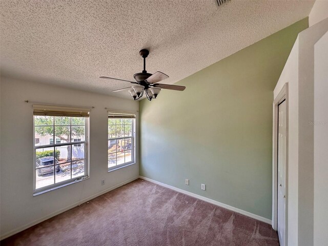 608 Black Lion Dr NE, Saint Petersburg, FL 33716 - carpeted empty room with a textured ceiling, a ceiling fan, and baseboards