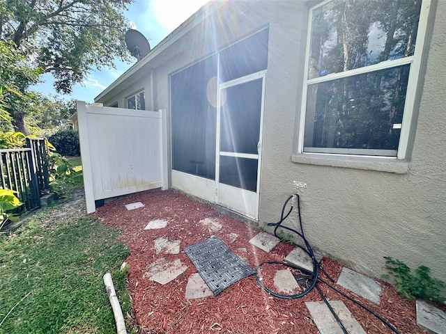 608 Black Lion Dr NE, Saint Petersburg, FL 33716 - view of home's exterior with stucco siding