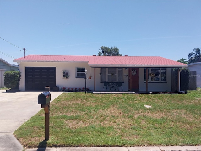 10142 118th Ave, Largo, FL 33773 - single story home featuring a garage, a front yard, concrete driveway, and metal roof