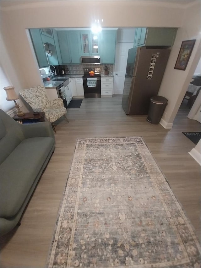 10142 118th Ave, Largo, FL 33773 - living area featuring light wood-style flooring