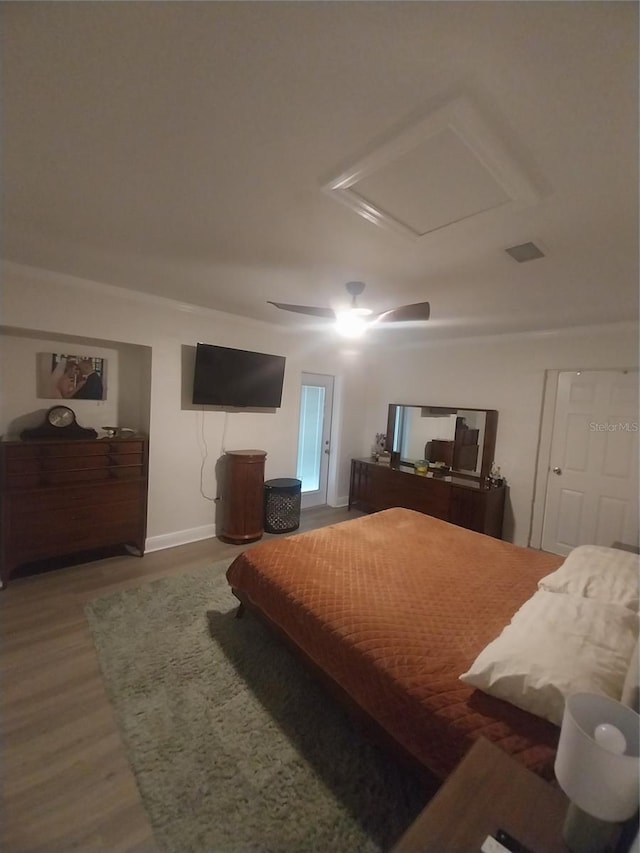 10142 118th Ave, Largo, FL 33773 - bedroom with attic access, wood finished floors, ceiling fan, and baseboards