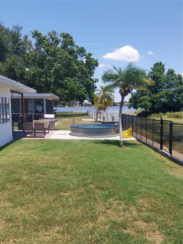 10142 118th Ave, Largo, FL 33773 - view of yard with a sunroom and a patio