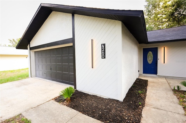 4260 Saint Lawrence Dr, New Port Richey, FL 34655 - entrance to property with stucco siding and a garage