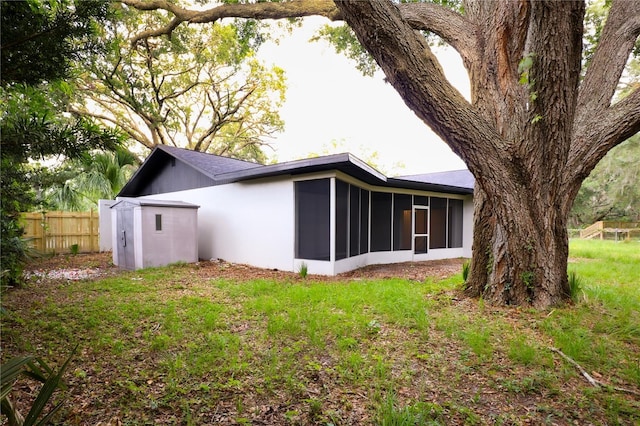 4260 Saint Lawrence Dr, New Port Richey, FL 34655 - rear view of house featuring a sunroom
