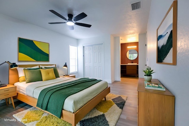 4260 Saint Lawrence Dr, New Port Richey, FL 34655 - bedroom featuring wood finished floors, a closet, and ceiling fan