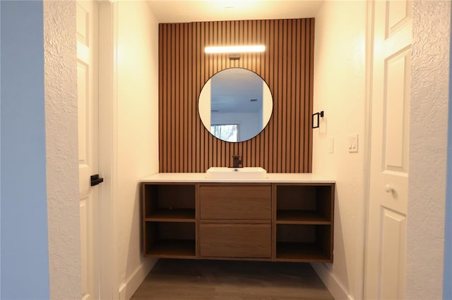 4260 Saint Lawrence Dr, New Port Richey, FL 34655 - bathroom with vanity, wood finished floors, and baseboards
