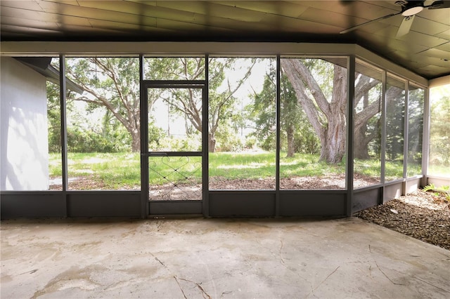 4260 Saint Lawrence Dr, New Port Richey, FL 34655 - unfurnished sunroom with a ceiling fan, plenty of natural light, and vaulted ceiling