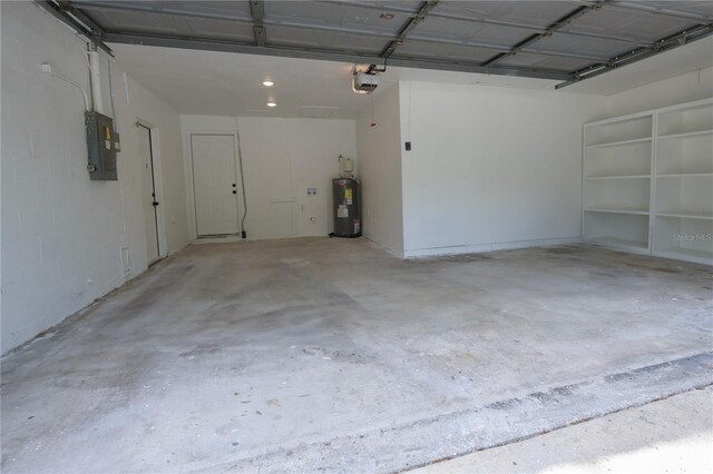 4260 Saint Lawrence Dr, New Port Richey, FL 34655 - garage featuring water heater, a garage door opener, and electric panel