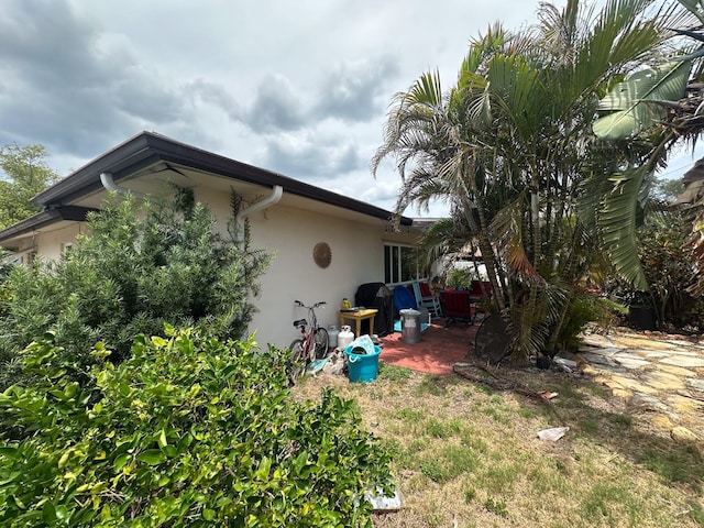 1559 San Roy Dr, Dunedin, FL 34698 - view of property exterior with stucco siding
