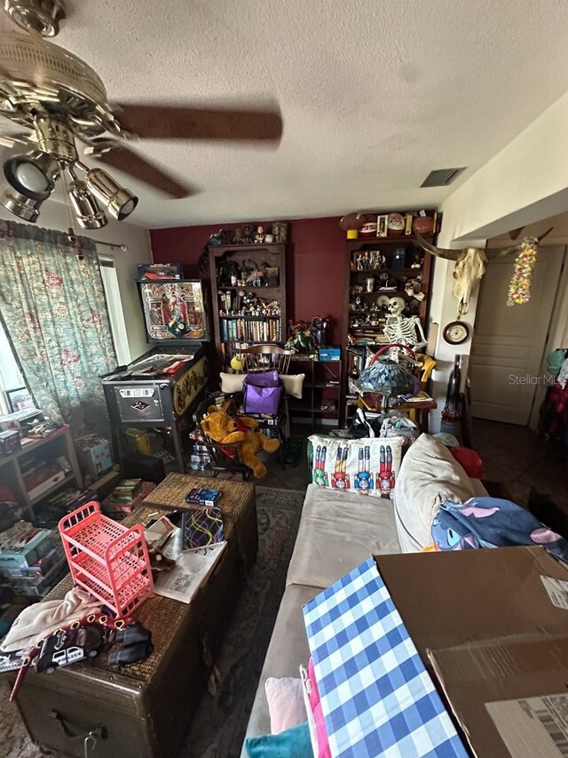 1559 San Roy Dr, Dunedin, FL 34698 - living area with a textured ceiling and ceiling fan