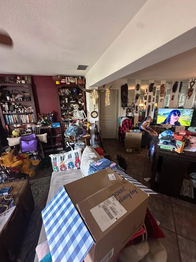 1559 San Roy Dr, Dunedin, FL 34698 - tiled living area with a textured ceiling
