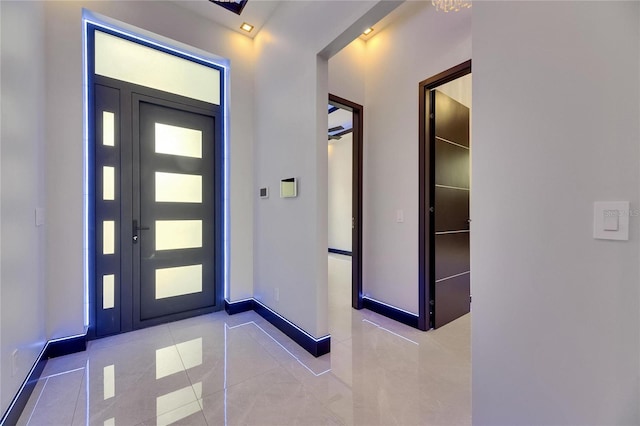 6534 Simone Shores Cir, Apollo Beach, FL 33572 - entryway featuring tile patterned floors and baseboards