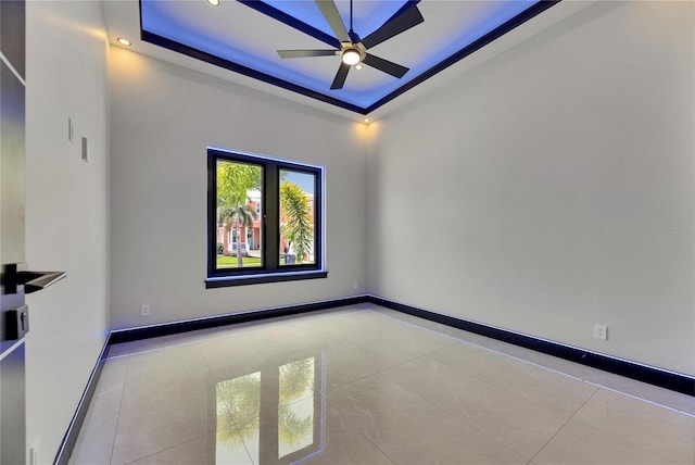 6534 Simone Shores Cir, Apollo Beach, FL 33572 - spare room with tile patterned flooring, a tray ceiling, ceiling fan, recessed lighting, and baseboards