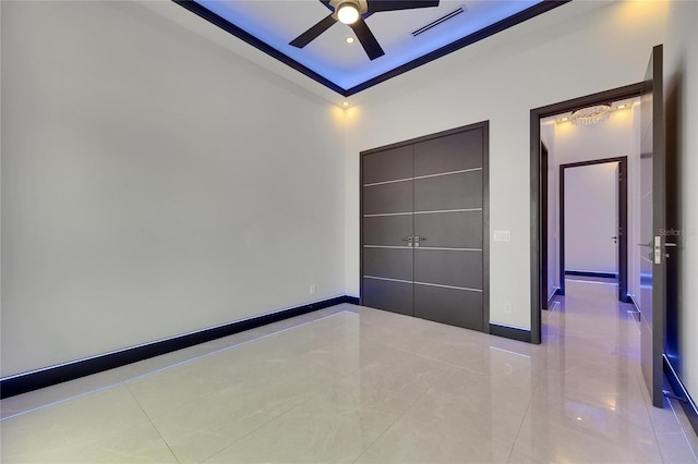 6534 Simone Shores Cir, Apollo Beach, FL 33572 - unfurnished bedroom featuring tile patterned flooring, baseboards, ornamental molding, and ceiling fan