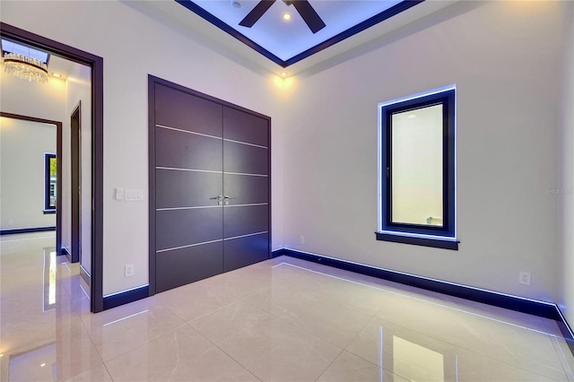 6534 Simone Shores Cir, Apollo Beach, FL 33572 - unfurnished bedroom with tile patterned floors and baseboards