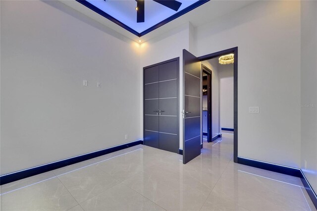 6534 Simone Shores Cir, Apollo Beach, FL 33572 - tiled spare room featuring baseboards and ceiling fan