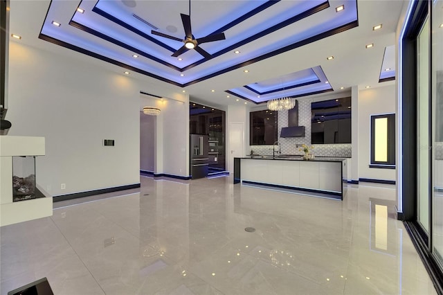 6534 Simone Shores Cir, Apollo Beach, FL 33572 - reception featuring a chandelier, a ceiling fan, and a sink