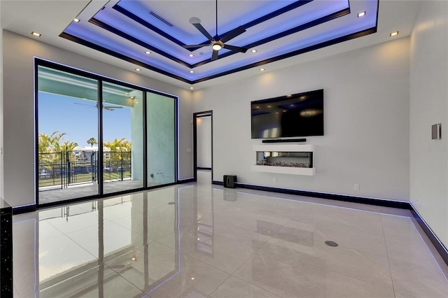 6534 Simone Shores Cir, Apollo Beach, FL 33572 - tiled spare room featuring a raised ceiling, ceiling fan, and baseboards