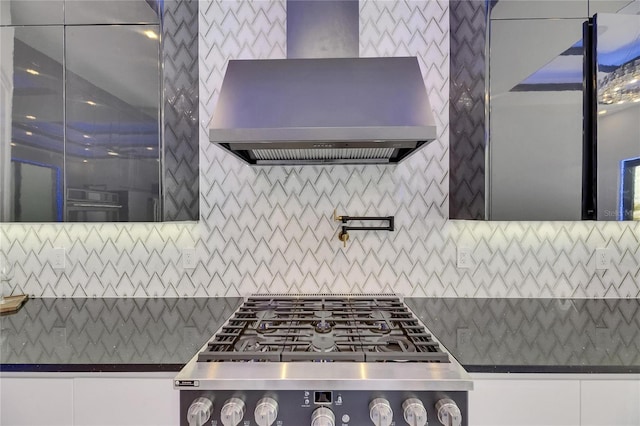 6534 Simone Shores Cir, Apollo Beach, FL 33572 - kitchen with wall chimney exhaust hood, dark countertops, backsplash, and stovetop