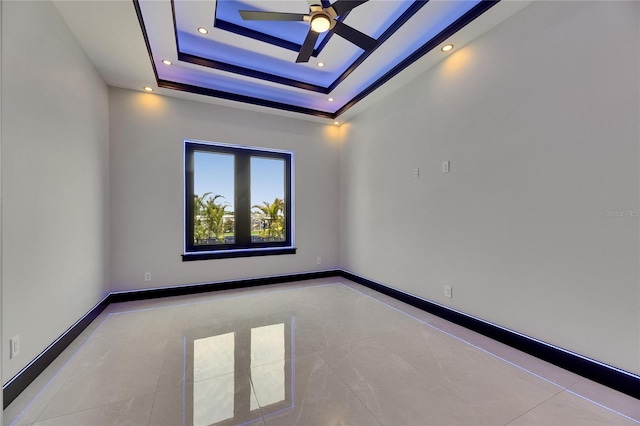 6534 Simone Shores Cir, Apollo Beach, FL 33572 - tiled spare room featuring ceiling fan, recessed lighting, a raised ceiling, and baseboards