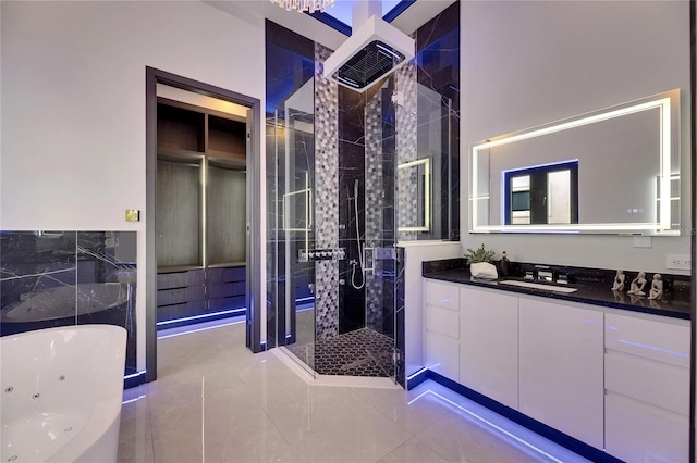 6534 Simone Shores Cir, Apollo Beach, FL 33572 - full bathroom featuring a shower stall, a tub with jets, vanity, and tile patterned floors