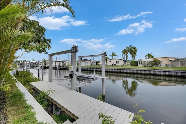 6534 Simone Shores Cir, Apollo Beach, FL 33572 - dock area with boat lift, a water view, and a residential view